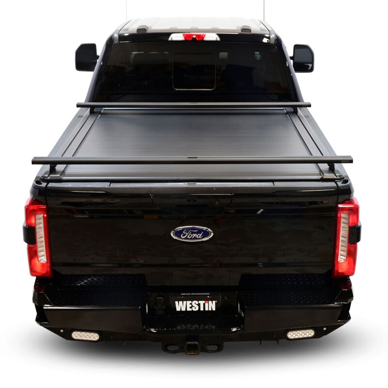 Westin black retractable tonneau cover for Ford F-250/F-350 SD 6.8ft bed, providing secure, easy-to-use truck bed protection.