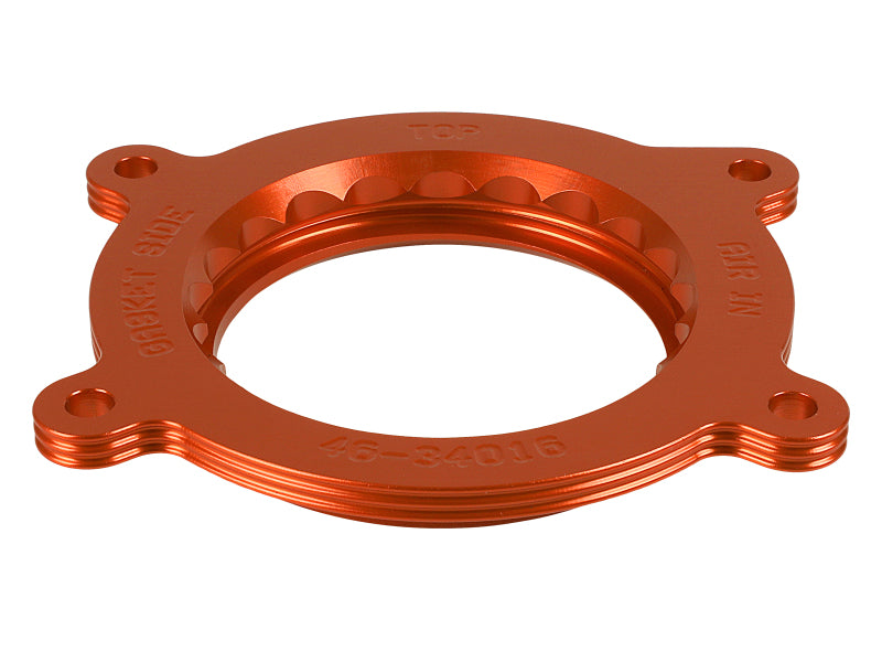 aFe Silver Bullet Throttle Body Spacer for GM trucks 1500 2014-2019 V8 6.2L engine, showing the metallic spacer component