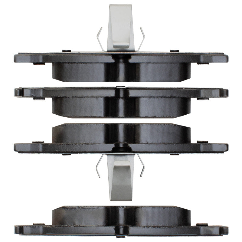 BMW 530i R1 Concepts OE brake pads for rear brakes, showing the brake pad set with metal backing and friction surface.