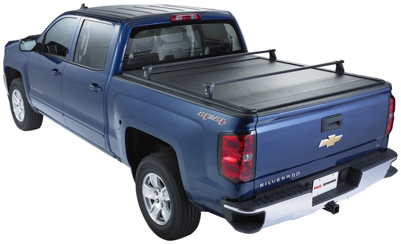 Pace Edwards Ultragroove retractable tonneau cover on a Nissan Titan King Cab pickup truck bed.