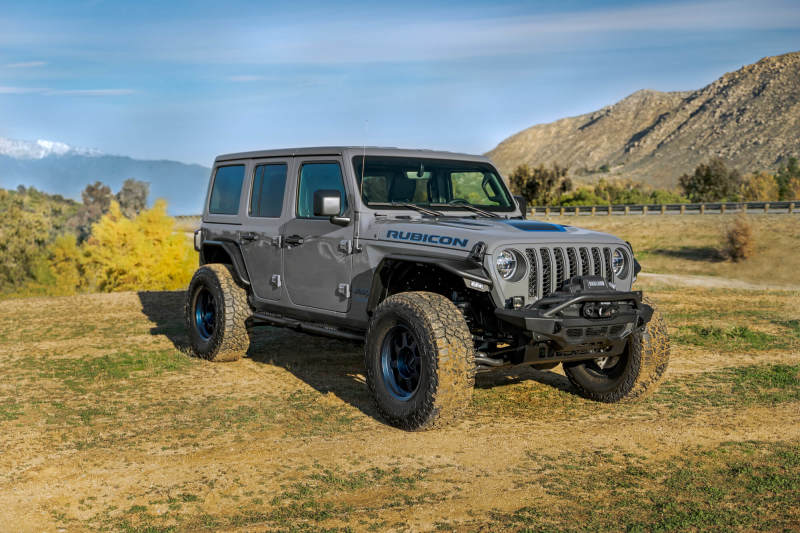 DV8 Offroad Jeep Wrangler JL Spec Series Tube Fenders, black metal with rugged design, installed on the vehicle's wheel arches.