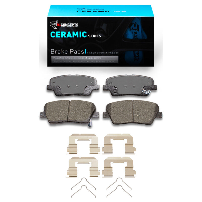 R1 Concepts Genesis G70 rear OE ceramic brake pads and hardware kit installed on a vehicle's brake assembly.