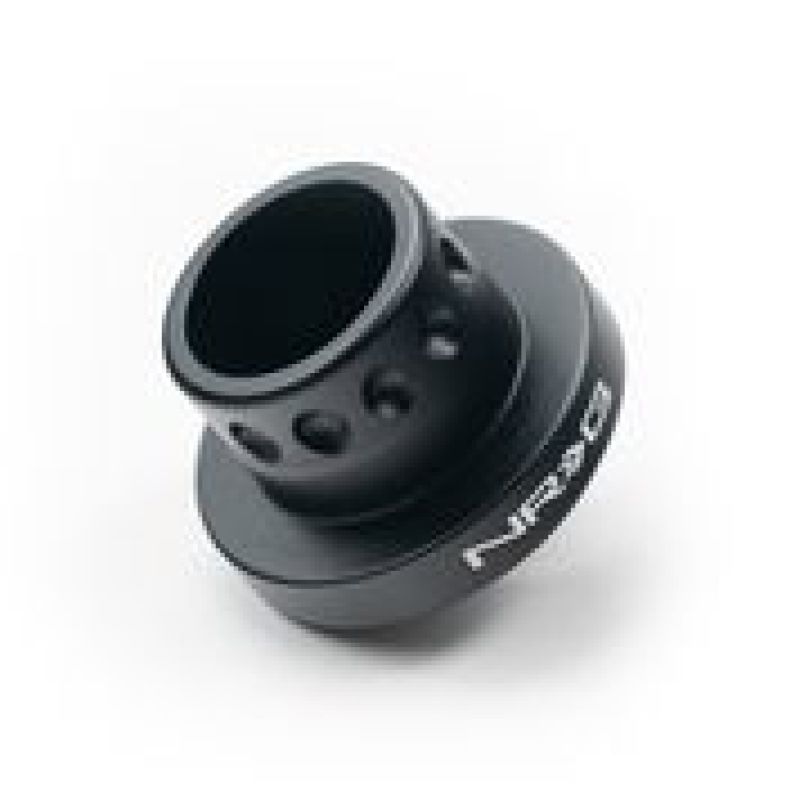 NRG Matte Black Short Hub Adapter for BMW M3, Z3, 318, 325, 328, and E39 steering wheel hubs, showing the compact design.