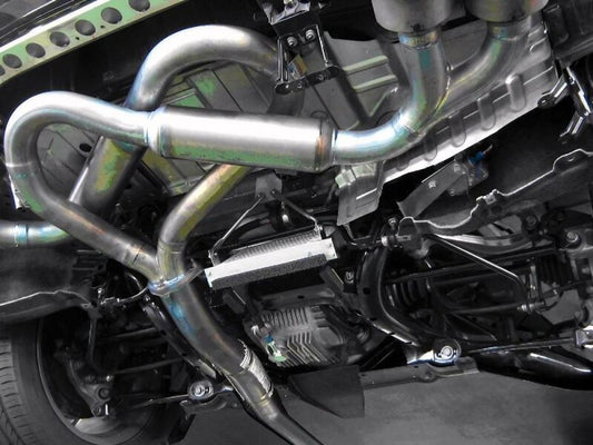 HKS differential oil cooler for R35 GT-R, black metal cooling system with hoses and mounting hardware visible.