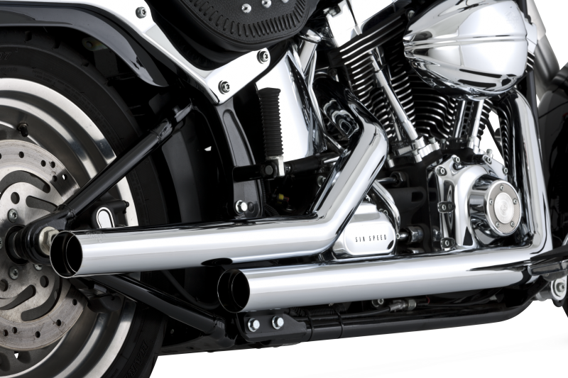 Vance & Hines Straightshots exhaust system installed on a Harley-Davidson Softail motorcycle, showcasing the polished chrome finish.