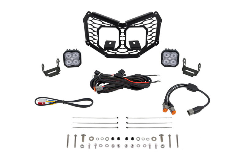 Diode Dynamics 17-24 Can-Am Maverick X3 Stage Series LED grille kit with white fog lights, installed on the vehicle's front grille.