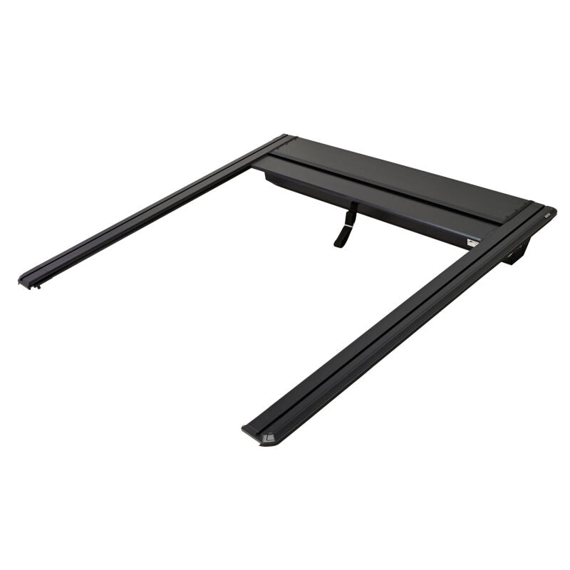 Westin manual retractable tonneau cover for 2022-2026 Toyota Tundra with 5.5ft bed in black, rolled up showing its sleek design.