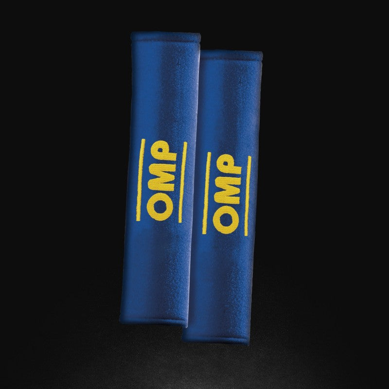 Pair of blue OMP belt pads for safety harnesses, 3 inches wide, providing comfort and protection for racing or automotive use.