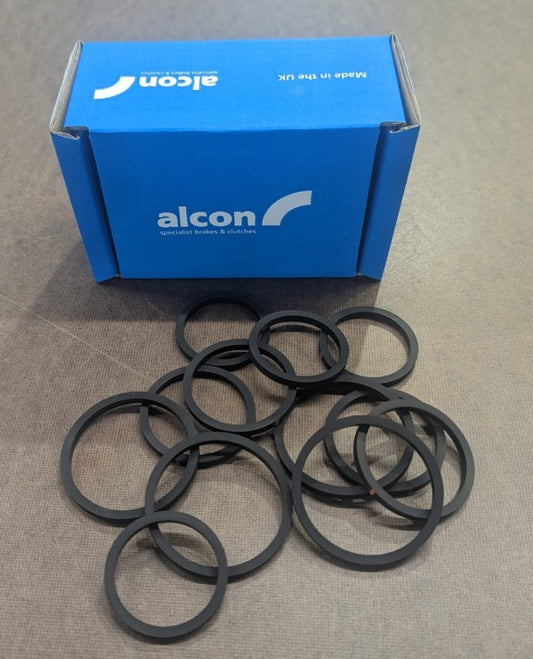 Alcon brake hardware axle set seal kit with seals and hardware components for vehicle brake system, brand Alcon.