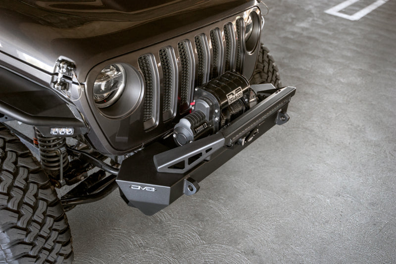 Steel offroad front bumper with plated bull bar for Jeep Wrangler and Gladiator, featuring stubby design by DV8 Offroad.
