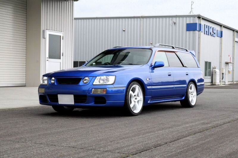 HKS Hipermax S WGNC34 coilover kit for 4WD models, showing adjustable shock absorbers and suspension components.