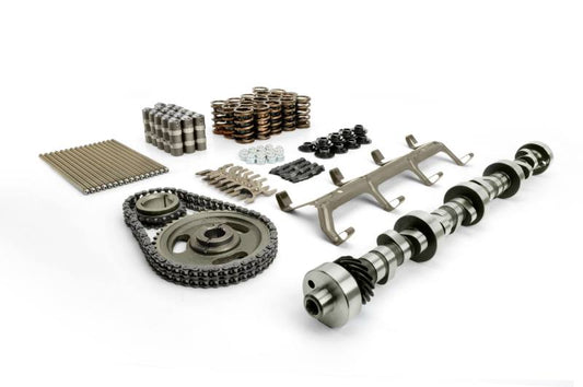 Close-up of COMP Cams FW 284H-R12 camshaft kit with metal camshaft components and gear for automotive engine performance.