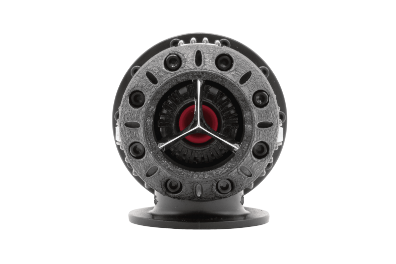 HKS Super SQV4 FL5 Black Edition blow off valve installed on a car, showcasing its sleek black finish and compact design.