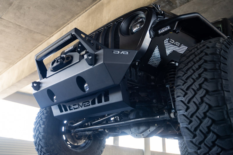 DV8 Offroad Jeep Wrangler JL/JT front bumper sway-bar disconnect motor skid plate, durable metal construction for off-road protection.