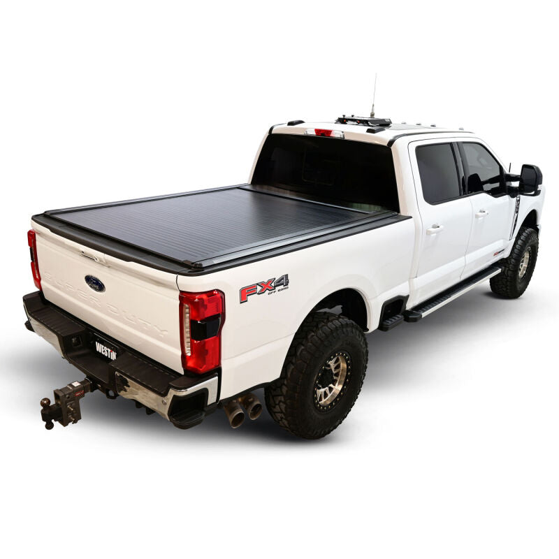 Black Westin roll-up tonneau cover on Ford F-250/F-350/F-450/F-550 SD 6ft 10in truck bed for secure cargo coverage