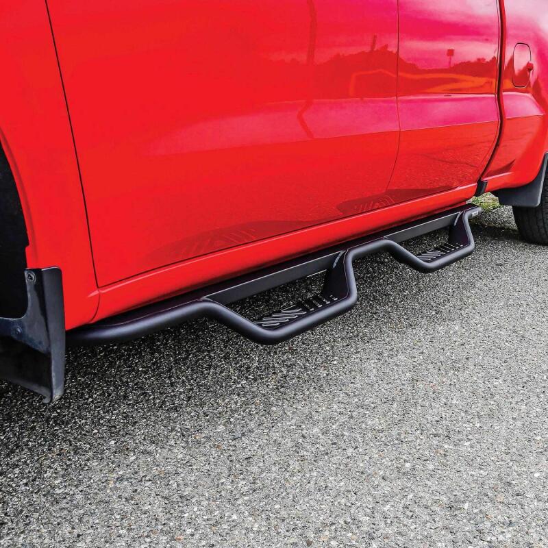 Westin Outlaw Drop Nerf Bars in Tex Black installed on 2014-2018 Chevy/GMC Silverado and Sierra double cab trucks.