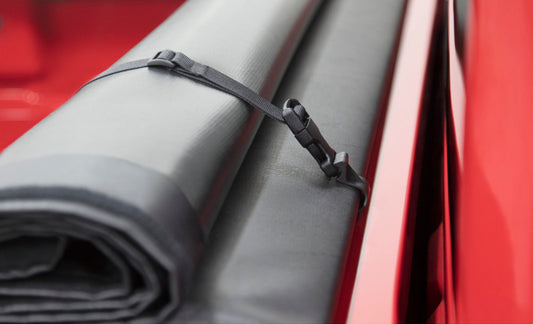 Access 2022+ Nissan Frontier 6ft bed roll-up cover shown on truck bed with secure, weather-resistant fabric and roll-up mechanism.