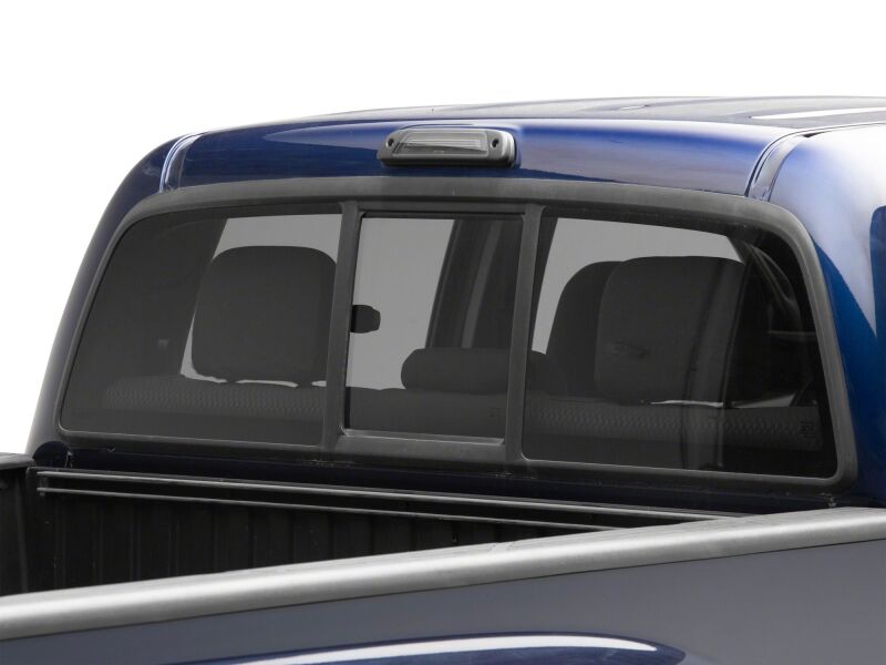 Smoked Raxiom LED third brake light for 2005-2015 Toyota Tacoma, showing the sleek, modern design and installation view