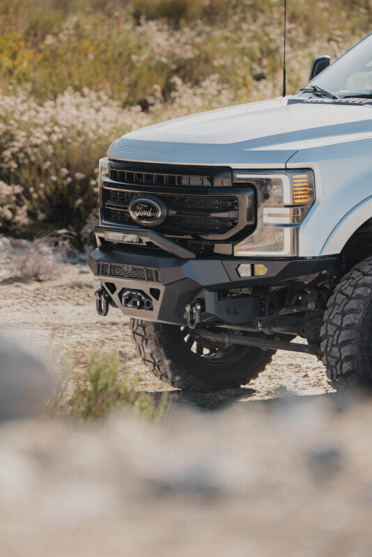 Steel front bumper for Ford Super Duty F-250/F-350 from DV8 Offroad Spec Series, rugged design with mounting points and heavy-duty construction.