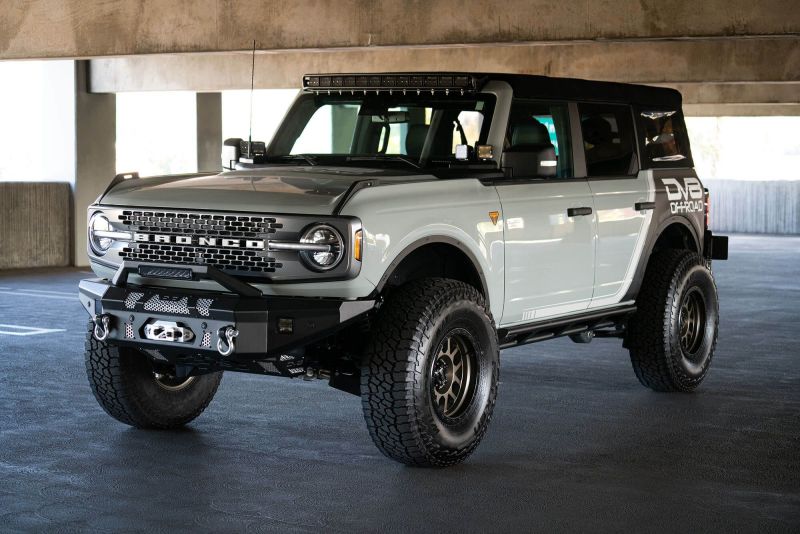 Steel DV8 Offroad Bull Bar Add-On for Ford Bronco bumpers, designed to fit 13-inch Elite Series light bars, offers rugged protection.