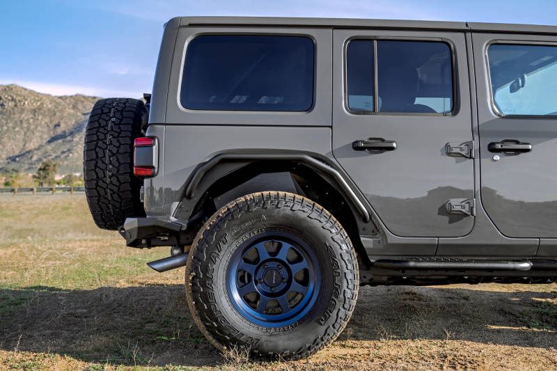 DV8 Offroad Jeep Wrangler JL Spec Series Tube Fenders, black metal fenders with rugged design for off-road protection.