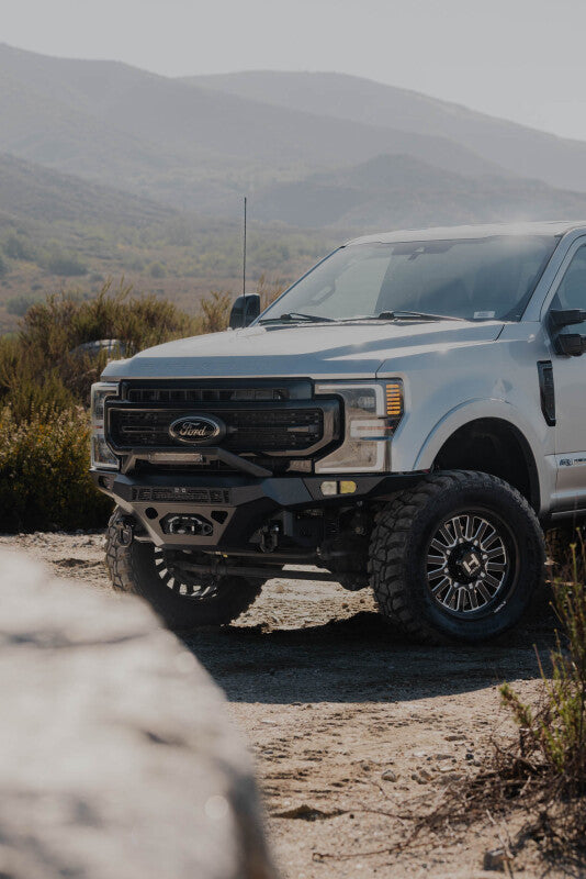 Steel front bumper for Ford Super Duty F-250/F-350 by DV8 Offroad, featuring durable construction and off-road-ready design.