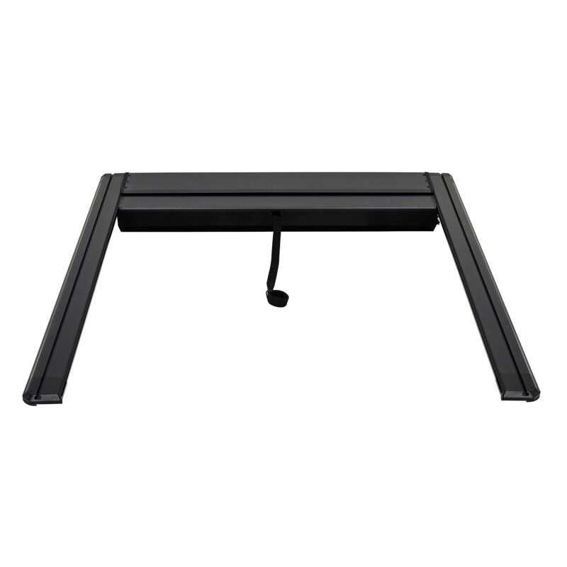 Westin 19-26 GM Silverado/Sierra 1500 black roll-up retractable tonneau cover on truck bed, manual operation.