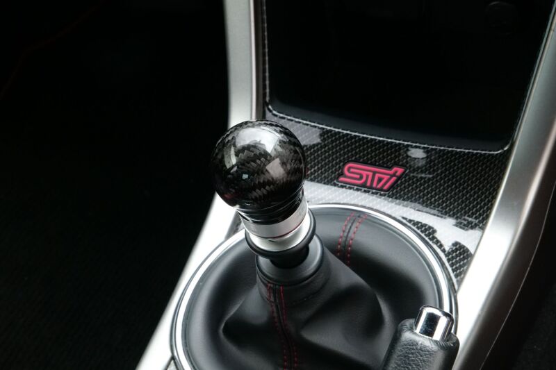HKS carbon shift knob for 2015-2021 Subaru WRX STI with 6-speed manual transmission, featuring a sleek black finish.