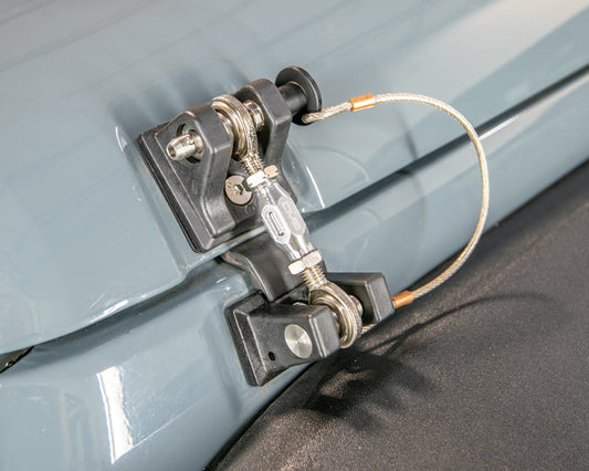 DV8 Offroad Jeep JK hood hold downs with durable hood pins for 2007-2018 Jeep Wrangler models, shown installed on the vehicle.