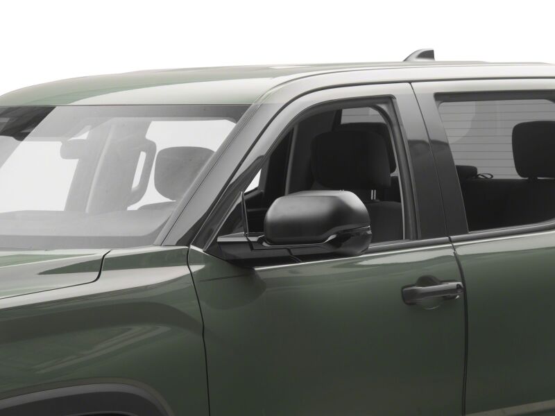 Raxiom smoked sequential LED side mirror lights for Toyota Tundra 22-26, installed on side mirrors, with LED strips and smoked lens.