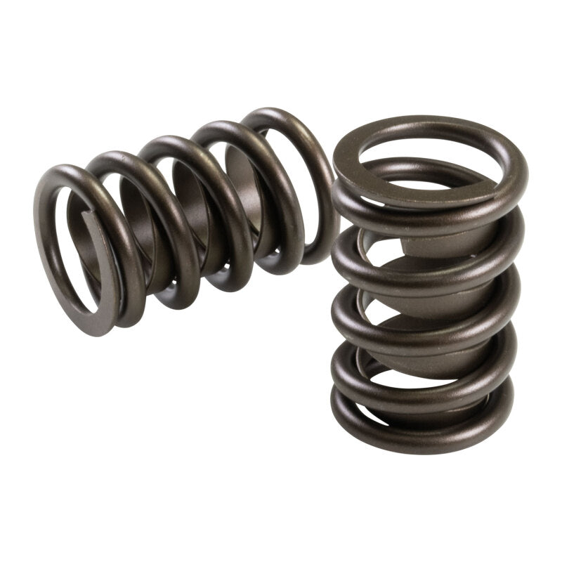 COMP Cams valve springs with 1.440-inch diameter and retainers, shown in a close-up image highlighting the spring coils and retainer components.