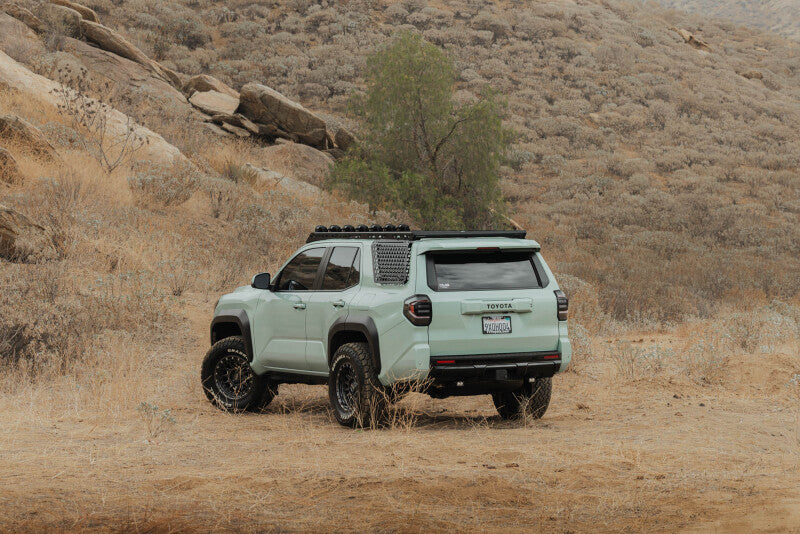 DV8 Offroad Toyota 4Runner exterior window Molle panel for DV8 roof rack on driver side, made of durable exterior trim material.