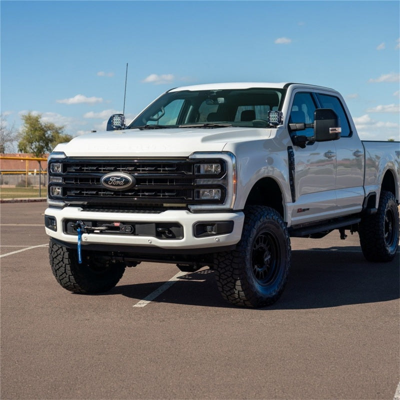 Rigid Industries 23-27 Ford F-250 SuperDuty D-SS light bars and cubes mounted on the truck's front grille.
