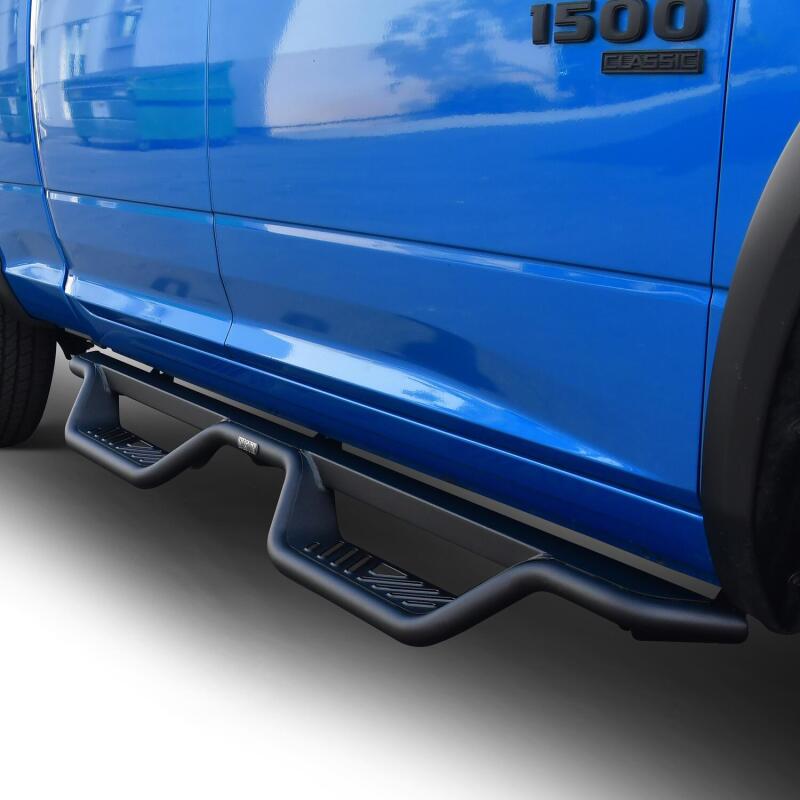 Westin Outlaw Drop Nerf Step Bars in textured black on a Ram 1500 Quad Cab/Classic, showcasing durable side steps.