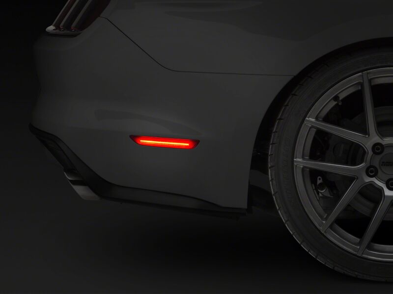 Red Raxiom Axial Series LED side marker lights for 2015-2023 Ford Mustang rear, clear lens with red LED indicators.