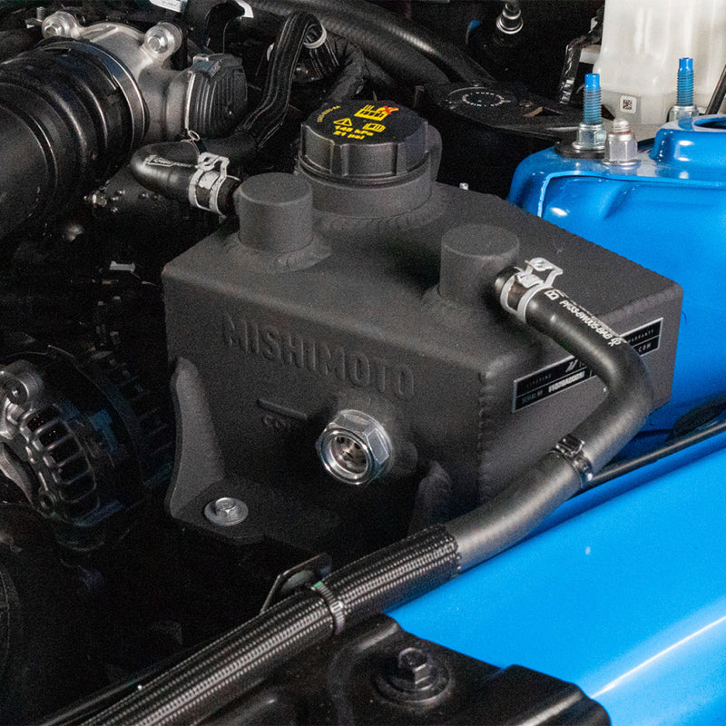Polished Mishimoto coolant expansion tank for 2024+ Ford Mustang V8 and EcoBoost EcoBoost engine, with a shiny finish.