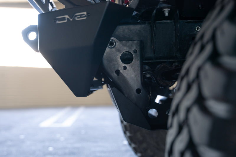 DV8 Offroad Jeep Wrangler JL/JT front bumper sway-bar disconnect motor skid plate, durable offroad protection for Jeep vehicles.