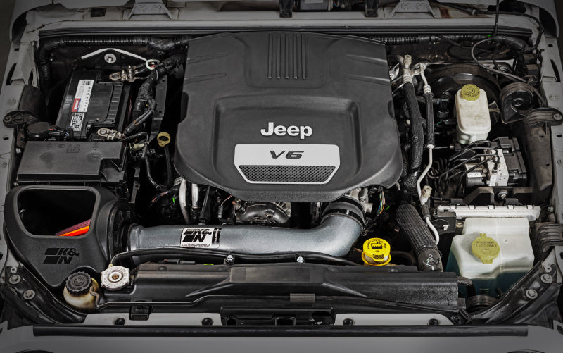 K&N 12-18 Jeep Wrangler NextGen aluminum cold air intake system installed in engine bay, enhancing airflow and performance.