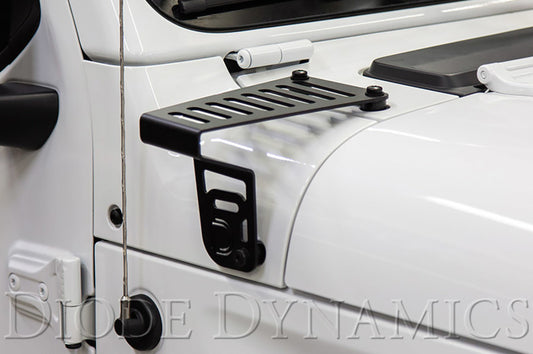 Diode Dynamics white LED cowl bracket kit installed on Jeep JL Wrangler or Gladiator with SS6 light bars for driving visibility.