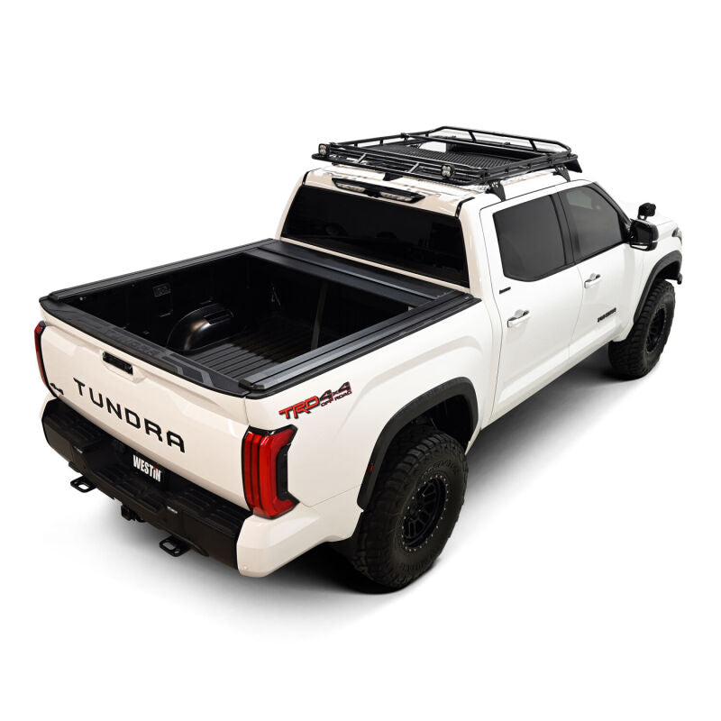 Westin manual retractable roll-up tonneau cover in black on a 22-26 Toyota Tundra with 5.5ft bed, showing the cover rolled open.