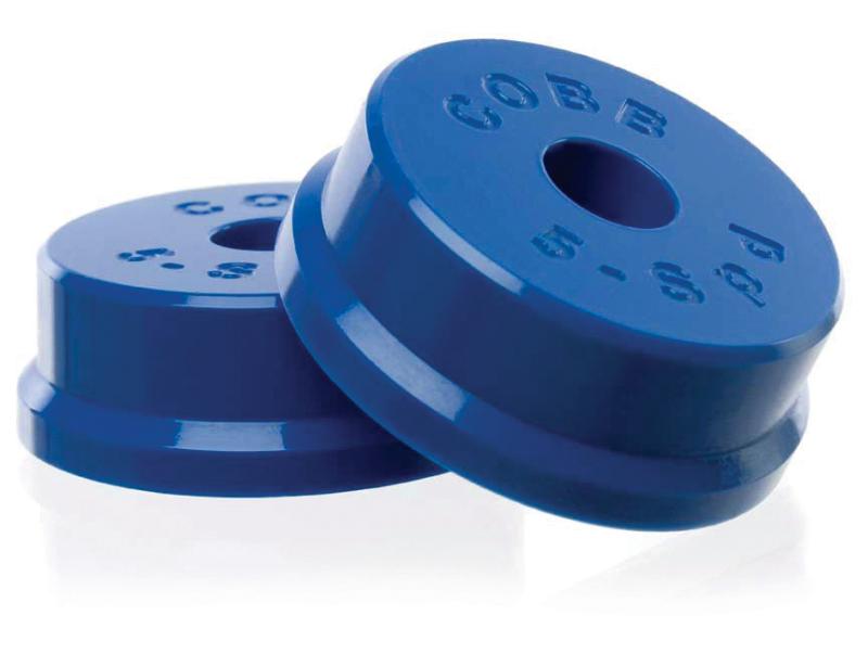 COBB shifter bushing for Subaru Impreza WRX and Legacy GT 5-speed manual transmission, close-up of the black rubber component