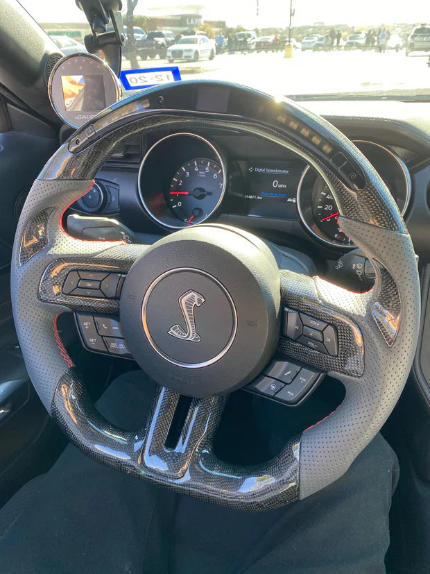 Custom Ford Mustang S550 carbon fiber steering wheel by Street Driven Performance, interior car accessory, detailed close-up image.