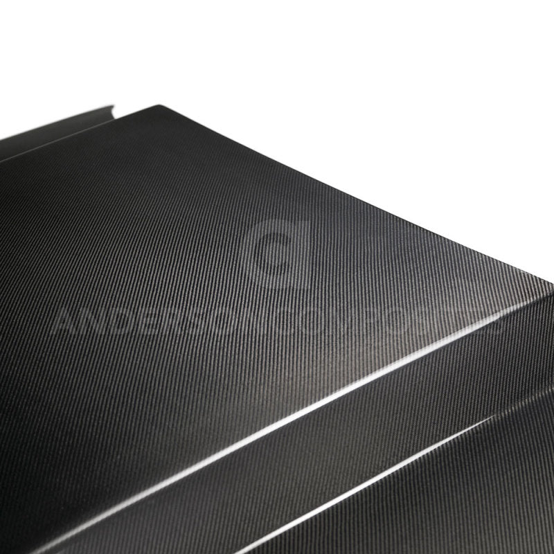 Anderson Composites carbon fiber cowl hood for 2013-2014 Ford Mustang, showcasing sleek textured surface and aerodynamic design.