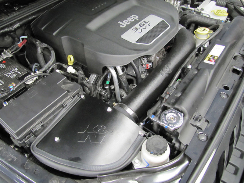 K&N Engineering cold air intake kit for Jeep Wrangler 12-13 3.6L V6 engine, featuring high-flow performance aircharger system.
